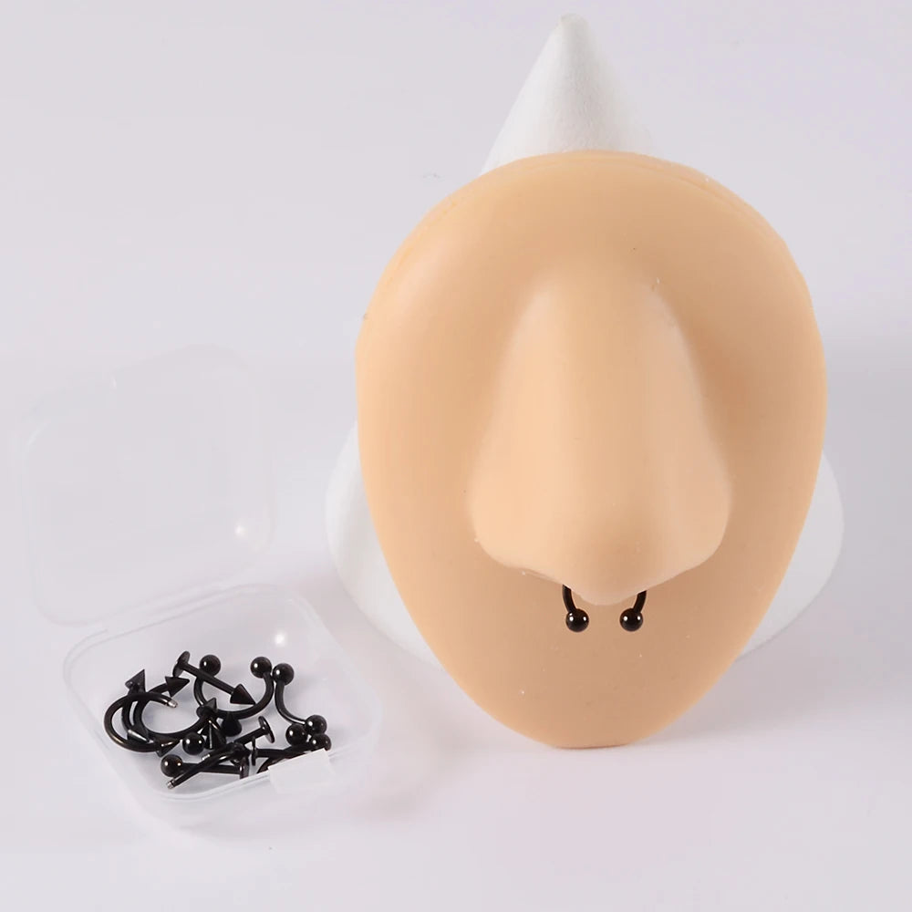 A set of 12 pieces of surgical steel, suitable for ear, nose, eyebrow and lip piercings.